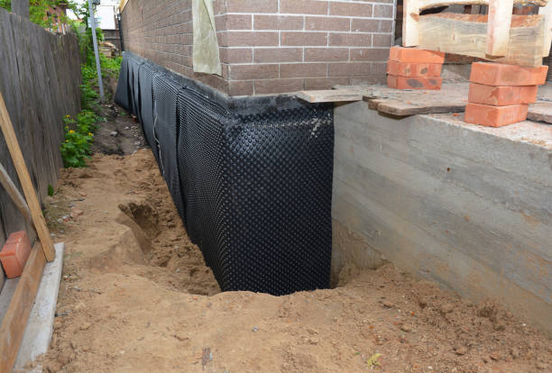 SJ Waterproofing Pros technician performing targeted Foundation Crack Repair assessment in Woodstock, MD